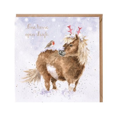 Horse wearing festive antlers in the snow Christmas card