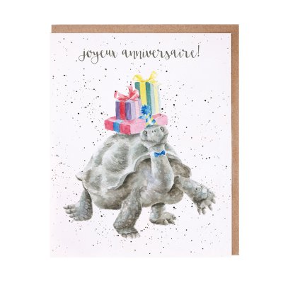 Tortoise in a bow tie and party hat with a pile of presents on its back French birthday card