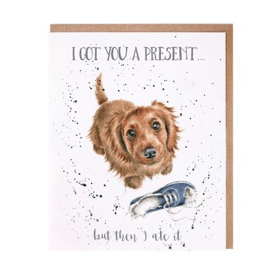 Puppy with a chewed up trainer birthday card