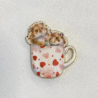 Hamsters in a mug needle minder
